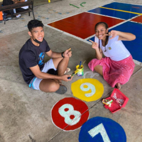 Students-from-the-Church-College-Fiji-repaint-numbers-on-the-playground-at-the-Hilton-Special-School.--August-2022