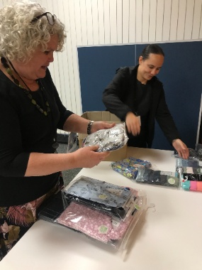 Yvonne-Rameka-and-Maria-Talamaivao-from-the-Pacific-Area-Office-load-packages-of-new-pyjamas-and-underclothes-headed-for-donation-to-Foster-Hope-in-Auckland,-New-Zealand.-June-2021