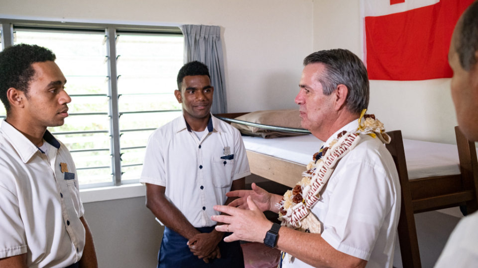 Elder-Ian-S-Ardern-talks-to-students-about-their-new-dorm-rooms-during-his-visit-to-the-LDS-Church-College-in-Fiji-to-dedicate-the-new-dormitories.-July-2022