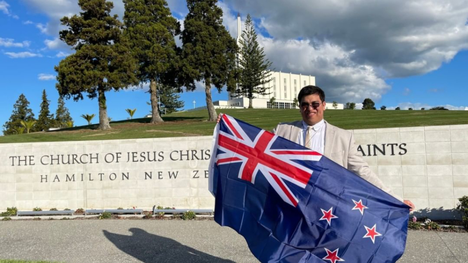 Elder-Alex-Murphy-with-the-New-Zealand-flag-at-the-Hamilton-New-Zealand-Temple.-He-always-wanted-to-serve-a-mission-in-New-Zealand.-May-2022