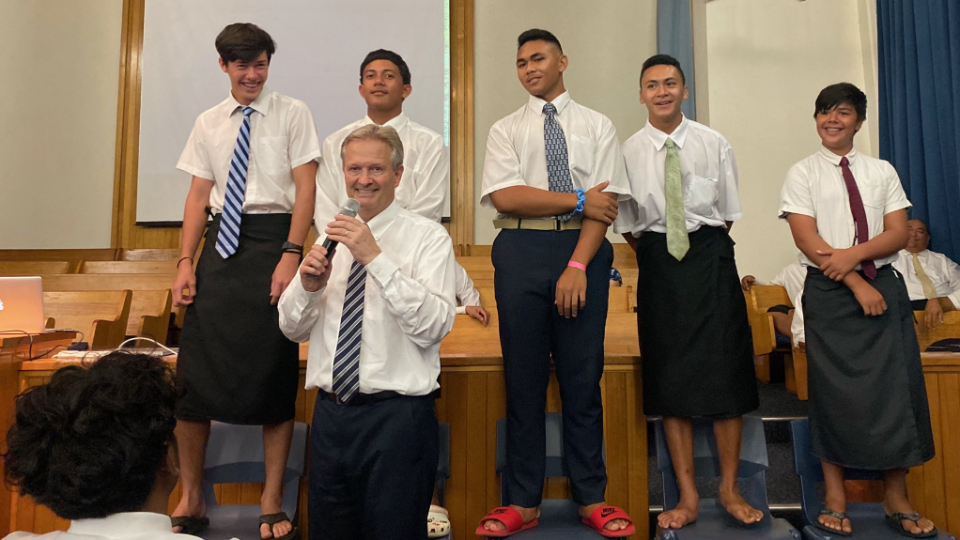 Young-men-help-Elder-K.-Brett-Nattress-with-a-teaching-moment-at-a-youth-devotional-in-American-Samoa.--November-2021