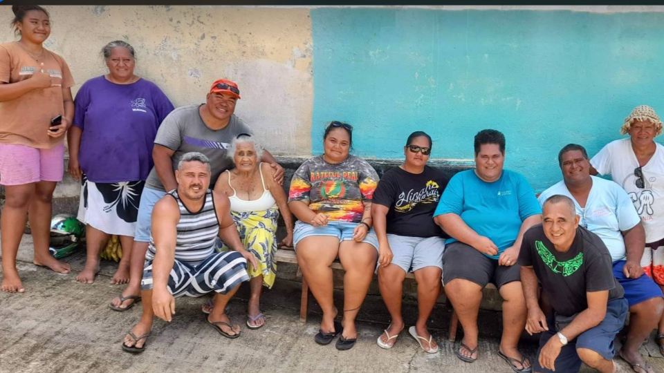 One-of-the-families-on-Maupiti-that-received-donations-of-food-and-necessities-after-they-lost-their-home,-with-members-who-made-the-delivery.-French-Polynesia,-April-2022