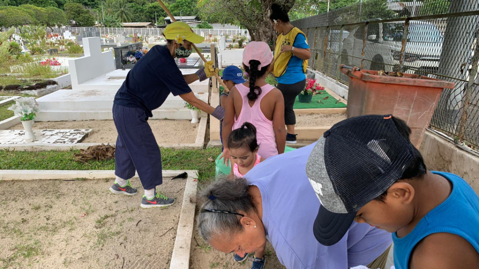 Members-from-two-wards-in-the-Arue-Tahiti-Stake-joined-together-to-clean-up-the-cemetery-in-the-city-of-Pirae,-French-Polynesia.-February-2022