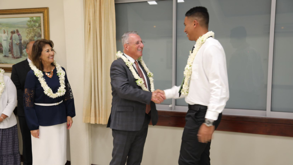 Elder-Ulisses-Soares-shakes-hands-with-a-young-man-from-Tahiti.-August-2022
