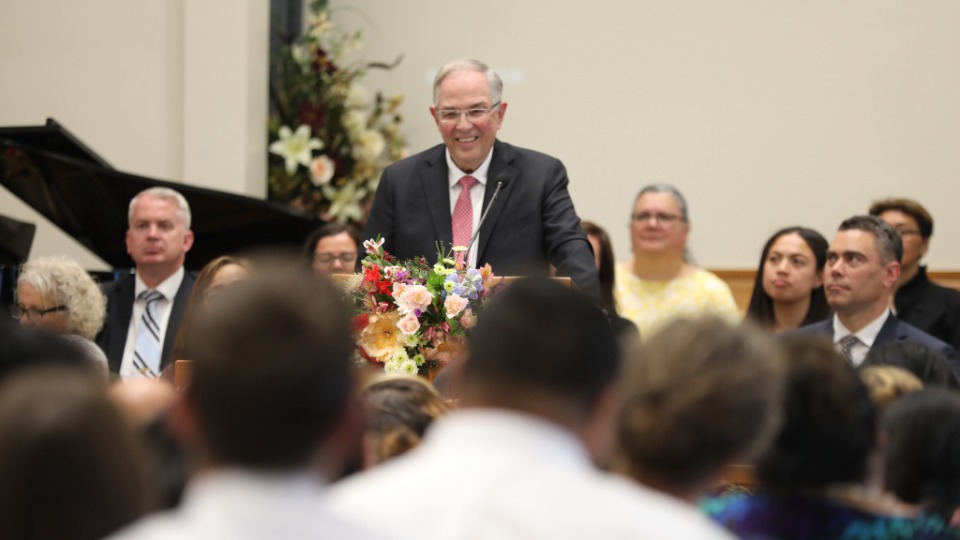 Elder Neil L. Andersen speaks during a devotional for members and friends of the Church.