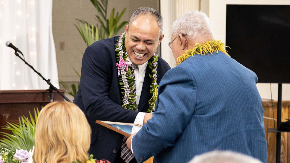 Elder-Faapito-Auapa'au-welcomes-a-guest-at-the-groundbreaking-event-for-the-Pago-Pago-Temple-in-American-Samoa.--October-2021