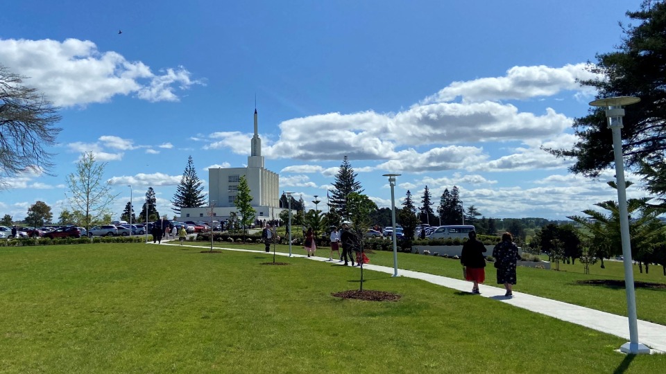 Members-of-The-Church-of-Jesus-Christ-of-Latter-day-Saints-walk-into-the-Hamilton-New-Zealand-Temple-to-attend-a-re-dedication-session-on-16-October-2022.-The-temple-has-been-closed-for-four-years-for-major-renovations.
