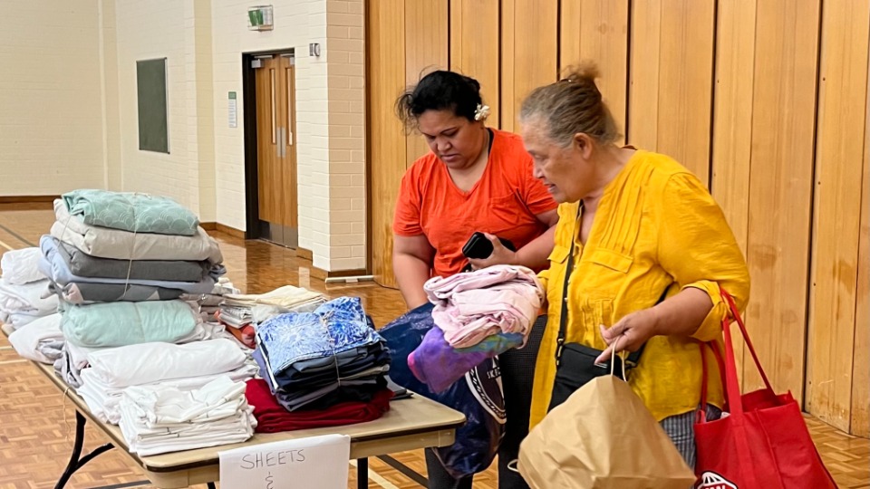 Women-donating-bedding-at-Auckland-area-service-project