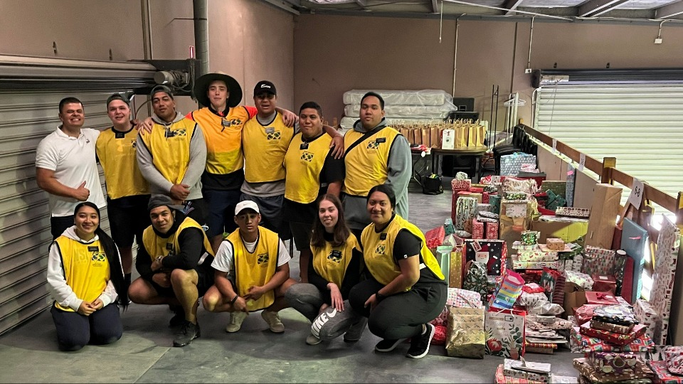 Volunteers collect and sort donated gifts for children in families experiencing tough times this Christmas season. December 2021. Melbourne, Australia.