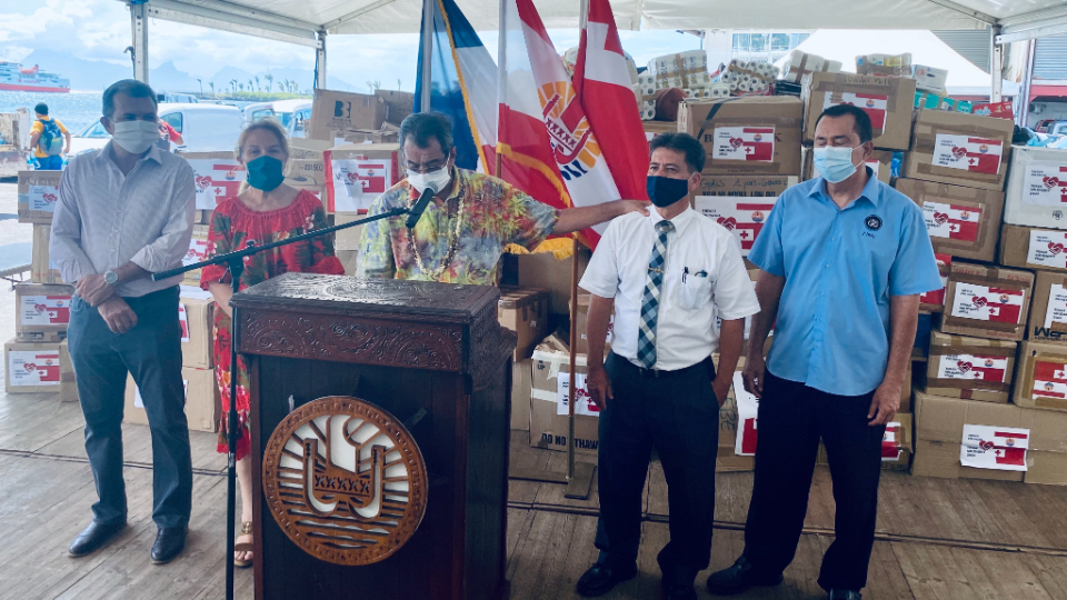President-Edouard-Fritch-speaks-at-a-press-conference-as-relief-supplies-are-loaded-onto-the-Tahiti-Nui-ship-heading-to-Tonga.-He-is-joined-by-Elder-Frederic-Riemer-from-The-Church-of-Jesus-Christ-of-Latter-day-Saints-and-Roger-Tetuanui-(right),-President-of-the-7th-Day-Adventist-Church-of-French-Polynesia.-January-2022.