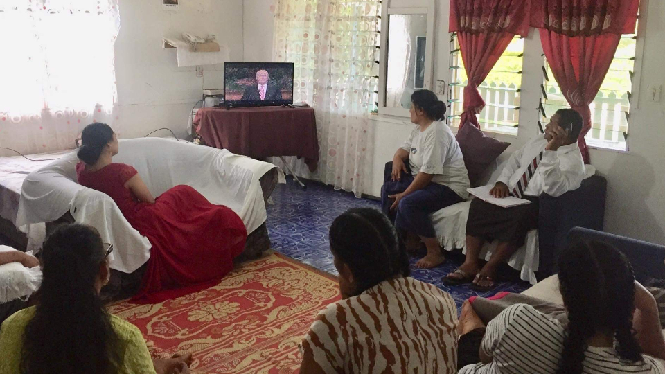Bishop-Tohiminiti-Latu-with-family-and-neighbors-watching-conference-in-Nuku'afola,-Tonga.--October-2021--