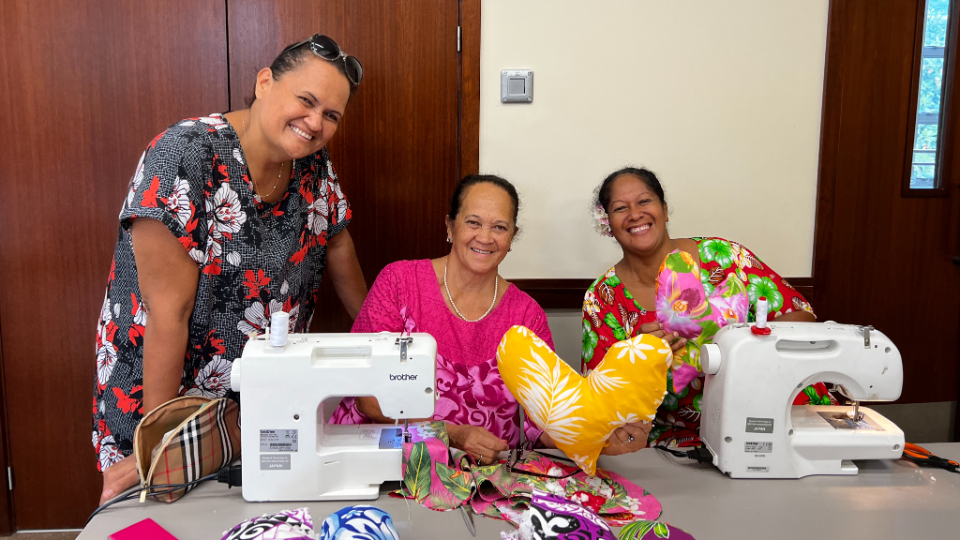 Tahitian-women-sew-heart-pillows-for-women-who-are-recovering-from-breast-cancer-surgery.--French-Polynesia,-May-2022